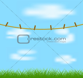 Clothespins on rope and blue sky