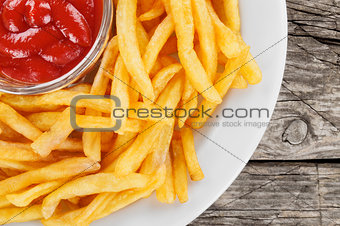 French fries closeup over wood