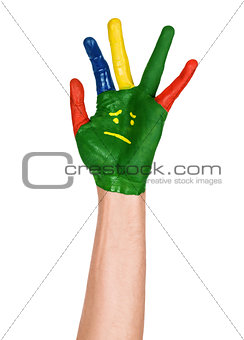 hand with a sad smiley on an isolated white background