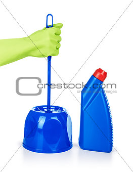 hand holds the brush to clean the toilet on an isolated white ba