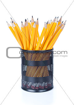 Bunch of pencils in a green cup isolated on white