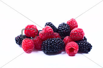 Blackberries and raspberries on a white background