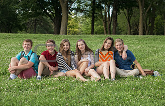 Teen Students Sitting Outdoors
