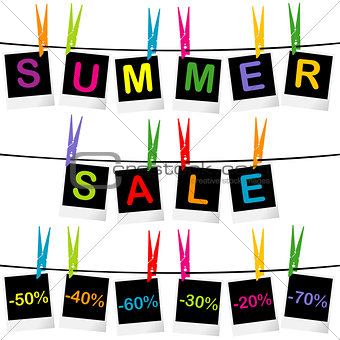 Summer sale concept with photo frames hanging on clothespins