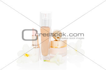 Beige feminine make up and cosmetic products.