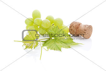 Wine cork and grapes.