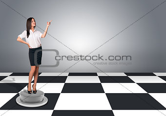 Businesswomen standing and pushing an imaginary buttons