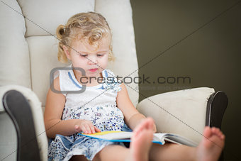Blonde Haired Blue Eyed Little Girl Reading Her Book