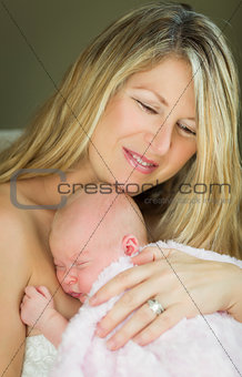 Young Beautiful Mother Holding Her Precious Newborn Baby Girl