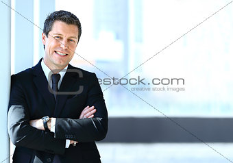 Portrait of smiling businessman working