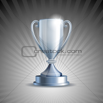 Silver trophy cup on grey background.