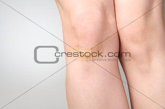 Plaster on female leg