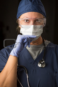 Concerned Female Doctor or Nurse Wearing Protective Facial Wear