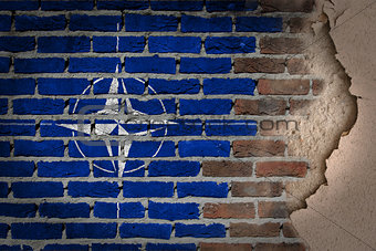 Dark brick wall with plaster - NATO