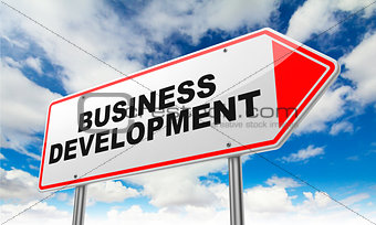 Business Development on Red Road Sign.