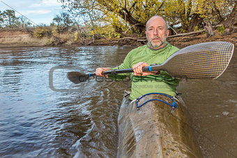 paddling sea kayak on a river