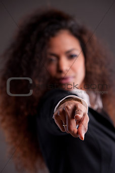 afroamerican girl pointing out her finger to you