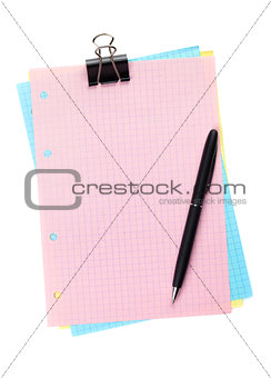 Colorful lined office paper with clip and pen