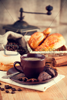 Cup coffee with grain and croissants