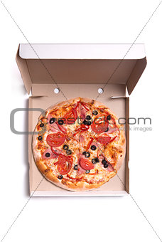 Tasty pizza with ham and tomatoes in box 