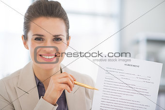 Portrait of happy business woman showing agreement