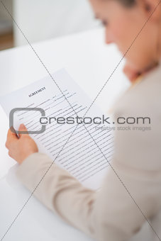 Closeup on business woman working with document. rear view