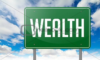 Wealth on Green Highway Signpost.