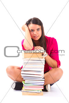 Portrait of a girl teenager with her books on white 