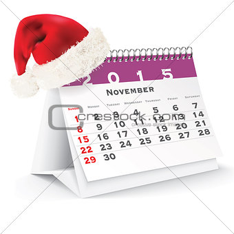 November 2015 desk calendar with Christmas hat