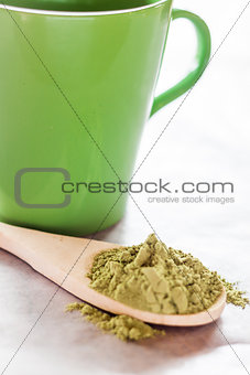 Making hot drink of green tea 