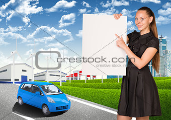 Businesswoman holding empty paper. Industrial zone, buildings and road with car 