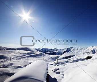 Ski resort and sky with sun