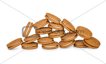 pile of tasty cookies with cream on isolated background 