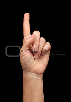 pointing gesture of the hand on a black background