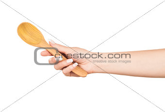 Woman hand with wooden spoon isolated on white background