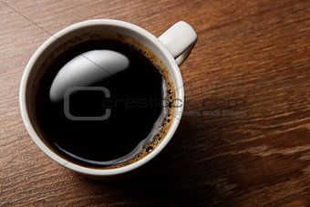 cup of black coffee on the desk