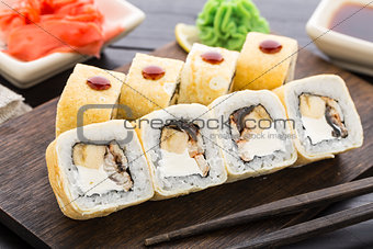 Sushi rolls with smoked eel and banana