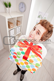 clerk with a big gift in wide-angle