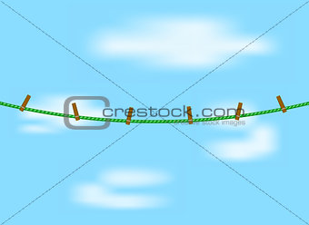 Clothespins on green rope