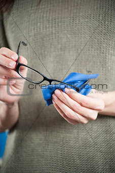 woman hands cleaning glasses