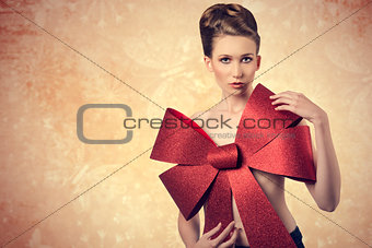 nude girl with glitter christmas bow 