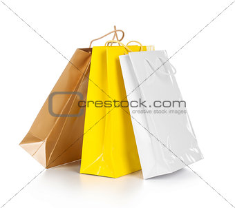 Bright gift bags isolated on white background