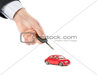 toy car and car key concept for insurance, buying, renting, fuel or service and repair costs 