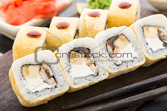 Sushi rolls with smoked eel and banana