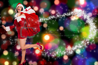 Composite image of woman standing with christmas presents
