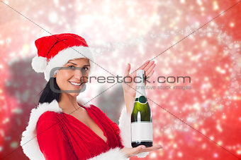 Composite image of woman holding a champagne bottle