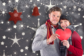 Composite image of smiling woman holding christmas presents