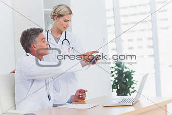 Composite image of medical team at the office