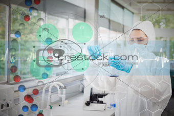 Composite image of scientist in protective suit working with green cell diagram interface