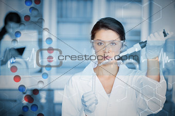 Composite image of serious chemist working with large pipette and test tube
